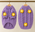 Lilac cable knit pet jumper with short sleeves and yellow crocheted daisies on the sleeves and back, shown front and back on hangers