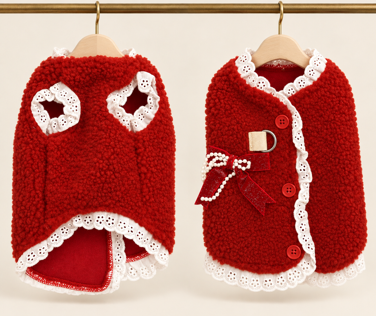 Red sherpa pet cape edged in white eyelet lace with three red buttons, a pearl bow and a lead D-ring