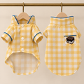 Butter yellow gingham pet shirt with blue piping, white press studs and a chocolate biscuit embroidered on the chest pocket