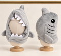 Grey plush shark hood for pets with white felt teeth around the face, a dorsal fin and an embroidered eye